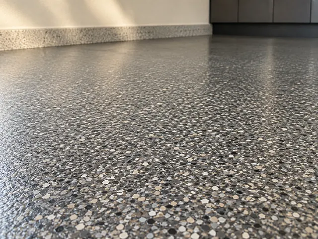 Design illustration showing charcoal, silver, and taupe flakes in a garage floor finish